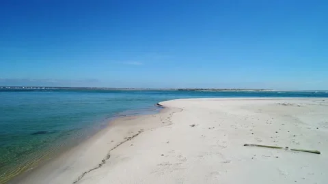 Tracking shot around the shore of small island Stock Footage 155465101