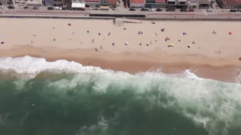 Tracking Shot of Atlantic Waves and Coastal Buildings Stock Footage 332573690