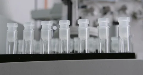 Tracking shot of automatic laboratory device moving samples Stock Footage 104821808