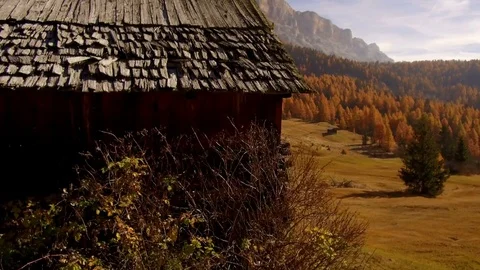Tracking shot barns in autumn Alta Badia, Dolomites Stock Footage 81480432