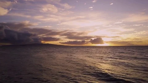 Tracking Shot Of A Beautiful Orange Sunset Over A Calm Ocean Video stock 83793704