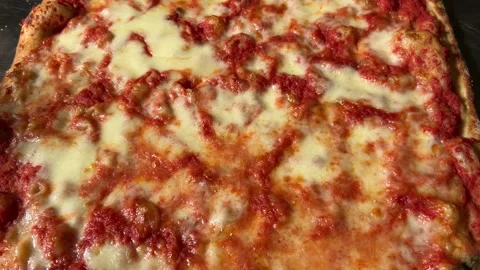 Tracking Shot on big square pizza in top view Stock Footage 310629685
