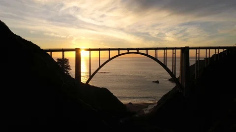 Tracking Shot of Bixby Bridge Facing the Sunset Stock Footage 112845364