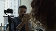 Tracking Shot Black Tech Worker Controlling Robotic Camera Arm With Female Stock Footage