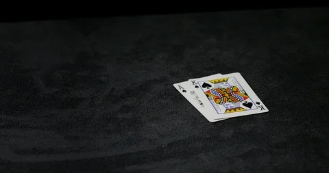 Tracking shot of blackjack, Ace and King on black table Stock Footage 100786791