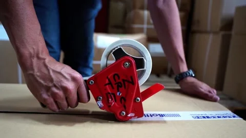 Tracking Shot Of Box Being Taped Stock Footage 155981851