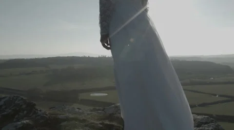 Tracking shot of bride on cliff Stock Footage 38840207