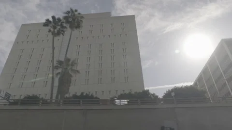 Tracking Shot of Buildings on LA Freeway Stock Footage 73813109