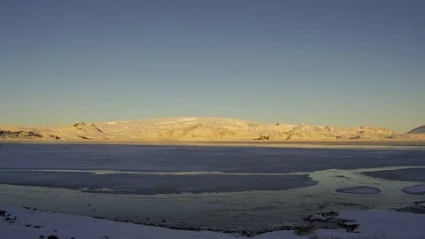 Tracking shot camera moves in a beautiful landscape with frozen lake, mountain Stock Footage 95307268
