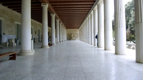 Tracking shot camera moves forward in interior length of Stoa of Attalos Athens Stock Footage 92438947