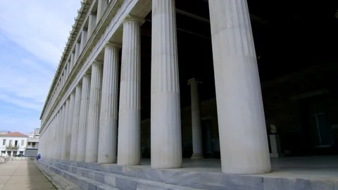 Tracking shot camera moves forward in exterior length of Stoa of Attalos Athens Stock Footage 92439114