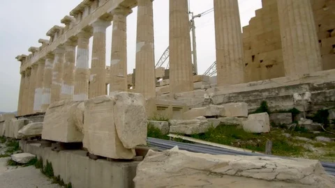 Tracking shot camera moves slowly around ruins of parthenon acropolis in Athens Stock Footage 92437550