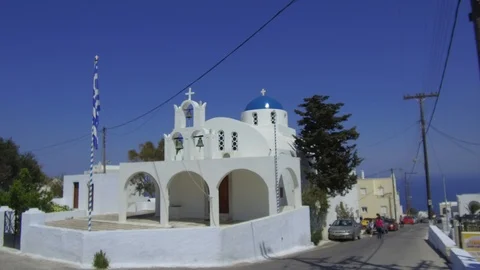 Tracking shot camera moves slowly around a church in Santorini Greece Stock Footage 92441131