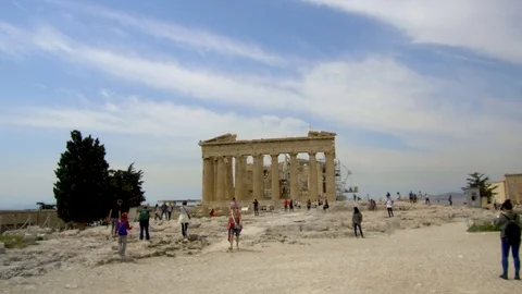 Tracking shot camera moves toward parthenon acropolis among visitors, tourists Stock Footage 92438321