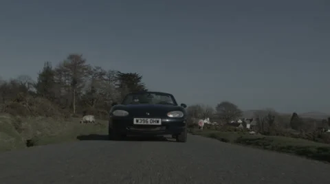 Tracking shot of car driving V2 Stock Footage 38834519
