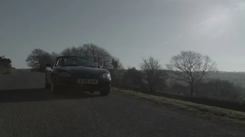 Tracking shot of car driving V8 Stock Footage 38842059