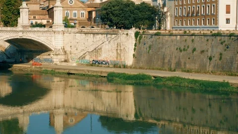 Tracking shot from the Castel Sant'Angelo bridge towards the dome of the Vatican Stock Footage 95466367
