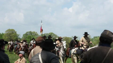 Tracking shot as cavalry ride past soldiers Stock Footage 39978634