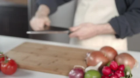 Tracking shot of chef sharpening knife in kitchen Stock Footage 92053538