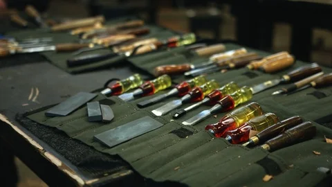 Tracking shot chisel holder on workbench Stock Footage 89801857