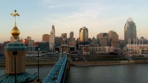 Tracking shot of Cincinnati skyline over Roebling bridge Stock Footage 100416531