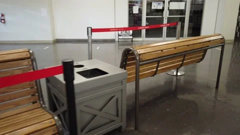 Tracking shot of closed benches escalator shopping mall Stock Footage 143986108