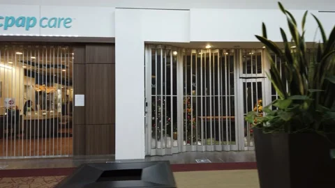 Tracking shot of closed stores in a mall Stock Footage 143985891