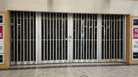 Tracking shot of closed stores in a mall Stock Footage 143985996