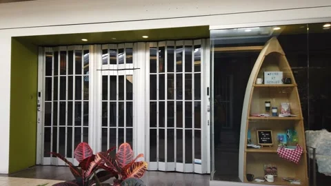 Tracking shot of closed stores in a mall Stock Footage 143986005