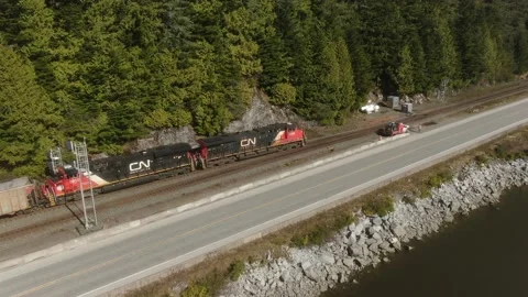 Tracking shot CN Rail train leaving a siding 4K Footage Stock Footage 149147051