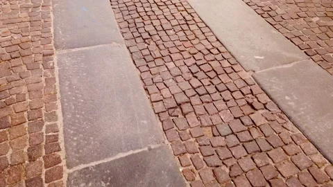Tracking shot on cobblestone road with large stone slabs Stock Footage 204130516
