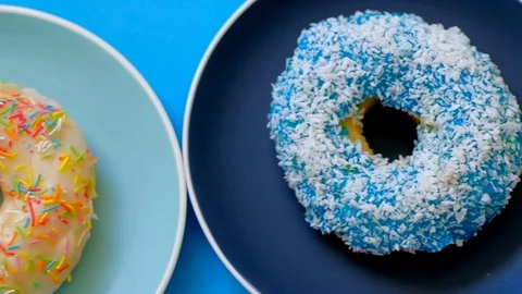 Tracking shot colored fresh donuts in box. Video stock 118641612