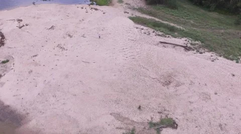 Tracking Shot coming in on Drone controller on Sand Bank Stockbeeldmateriaal 58633344