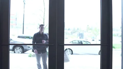 Tracking shot of a couple entering a lobby Stock-Footage 76235029