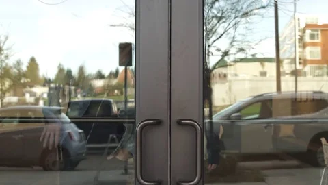Tracking shot of a couple leaving a building Stock-Footage 76538893