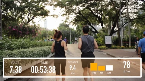 Tracking shot, Couple running with Activity Tracker overlay Vídeo Stock 104095257