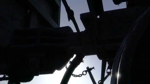 Tracking shot of coupling railway carriage for linking freight train wagon Stock Footage 75072854