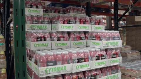Tracking shot of a crate with energy drinks in warehouse  스톡 동영상 79832400