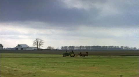 Tracking shot of crops, farm vintage tractor Stock Footage 29807341