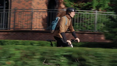 Tracking shot of cyclist riding through city streets Stock-Footage 317562057