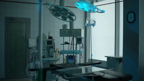 Tracking shot of dark interior modern operating room and equipment in hospital 스톡 동영상 260926055