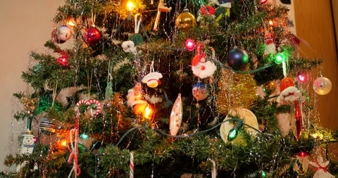 Tracking shot of decorations on Christmas tree. Video stock 100063395