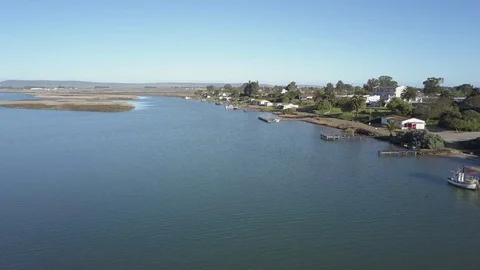 A tracking shot down the Berg river past Bokkom Laan Velddrift. Stock Footage 82709598