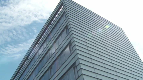 Tracking shot of a downtown office building on a sunny afternoon Stock Footage 42394529