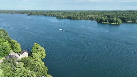 Tracking shot from drone along St Lawrence River Ontario Thousand Islands 스톡 동영상 253660749