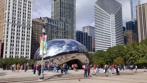 Tracking shot on east side of Chicago Bean, Michigan Ave buildings in background 库存影片 220468069