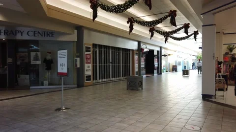 Tracking shot of an empty aisle in a mall Stock Footage 143986044
