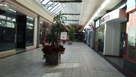Tracking shot of an empty aisle in a mall Stock Footage 143986111