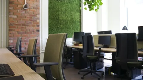 Tracking shot of empty open space office, furniture and modern computers Stock Footage 241277330