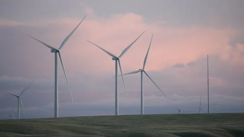Tracking shot of energy producing wind turbines Stock Footage 235468333